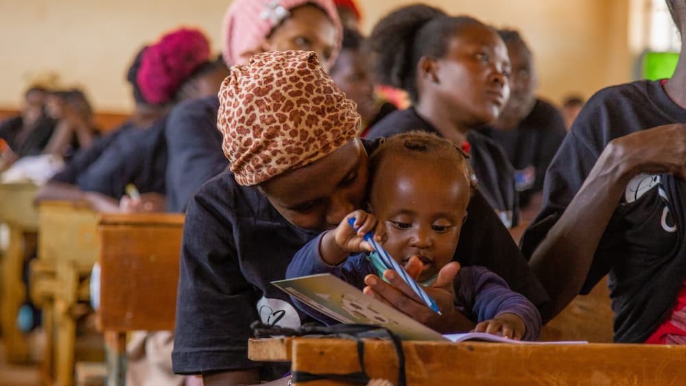 woman with child in class